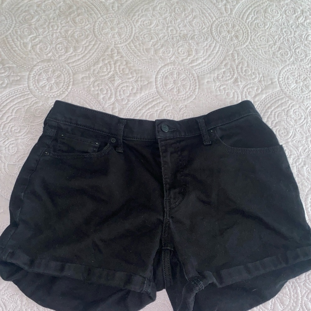 Womens Levi’s mid length black denim shorts . Size 32